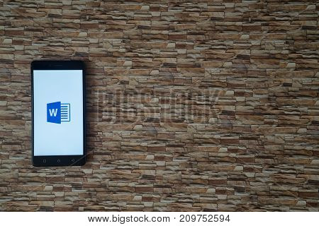 Los Angeles, USA, october 19, 2017: Microsoft office word logo on smartphone screen on stone facing background