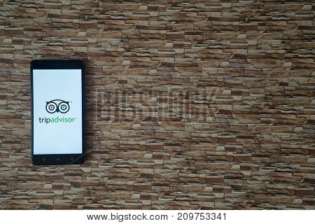 Los Angeles, USA, october 18, 2017: Tripadvisor logo on smartphone on background of small stones