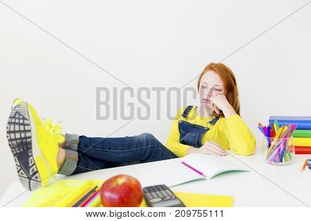 Smart girl is sudying and doing her homework