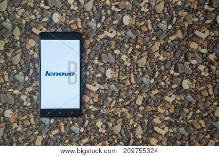 Los Angeles, USA, october 18, 2017: Lenovo logo on smartphone on background of small stones