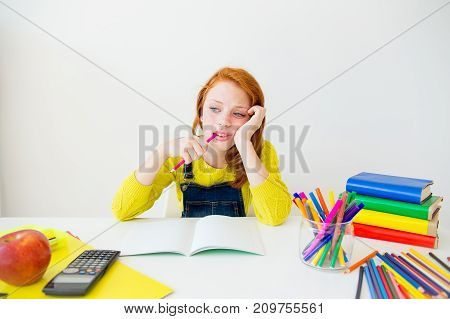Smart girl is sudying and doing her homework