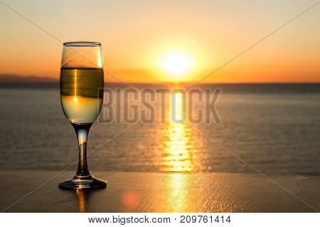 Sun path on the water, afternoon, single wineglass