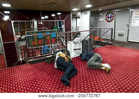 Palermo.Italy.27 may 2017.The passengers of the ferry GNV sleeping on the floor on the passenger decks. Sicily