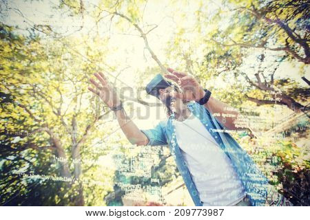 Man using virtual reality 3D glasses in park