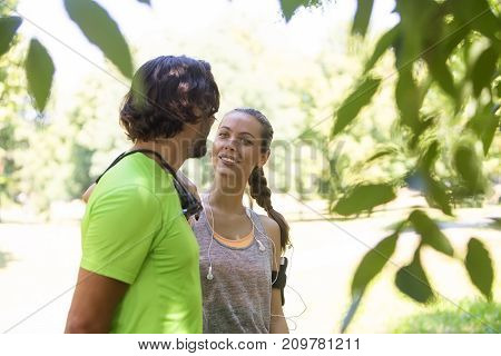 Smiling Couple Stretching Outdoors