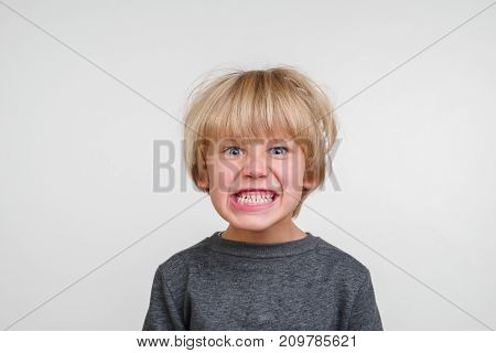 Cute horisontal portrait of handsome happy child