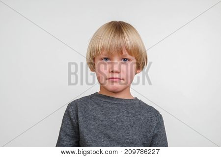 Fine horisontal photo of handsome happy caucasian child