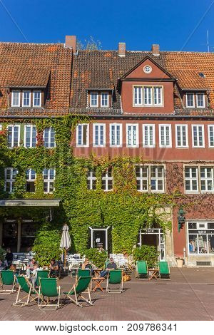 HANNOVER, GERMANY - OCTOBER 15, 2017: People enjoying the sun at the Ballhofplatz square in Hannover Germany
