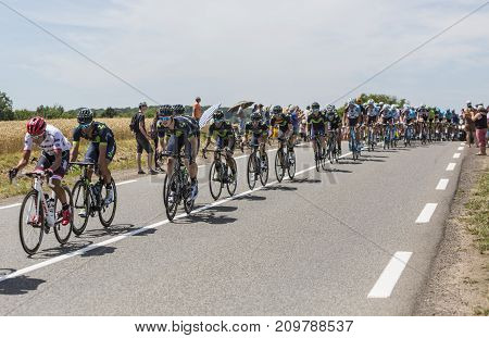 Mailleroncourt-Saint-Pancras France - July 5 2017: Team Movistar and Nairo Quintana riding in the peloton riding on a road to La Planche des Belle Filles during the stage 5 of Tour de France 2017.