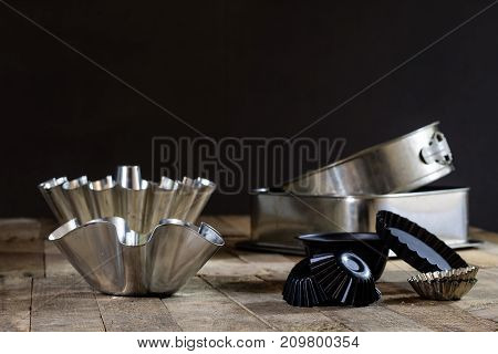 Old Baking Molds On An Old Kitchen Table. Baking Accessories In The Kitchen.