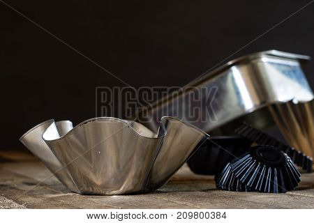 Old Baking Molds On An Old Kitchen Table. Baking Accessories In The Kitchen.