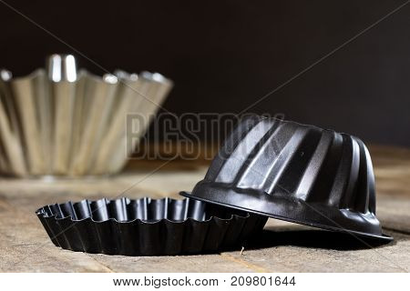 Old Baking Molds On An Old Kitchen Table. Baking Accessories In The Kitchen.