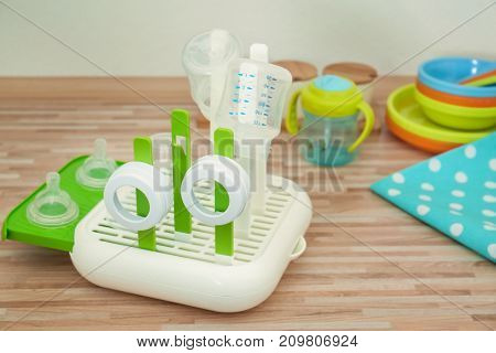 Drier with baby bottles on table