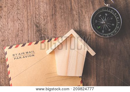 Vintage compass on the very old paper or letter envolope and wood toy