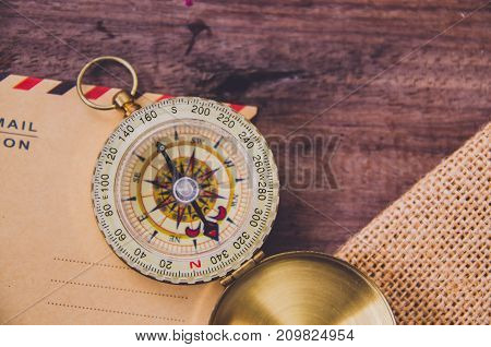 Vintage compass on the very old paper or letter envolop