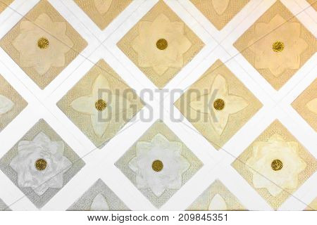 Wall with rhombus and flowers decorations. Vintage style. It can be used as background.