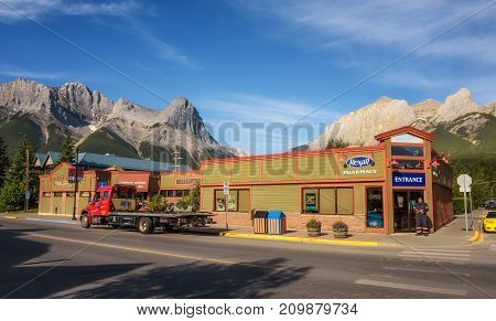 CANMORE, ALBERTA, CANADA - JUNE 26, 2017 : On the streets of Canmore in canadian Rocky Mountains. Canmore is located in the Bow Valley near Banff National Park and is a popular tourist destination.