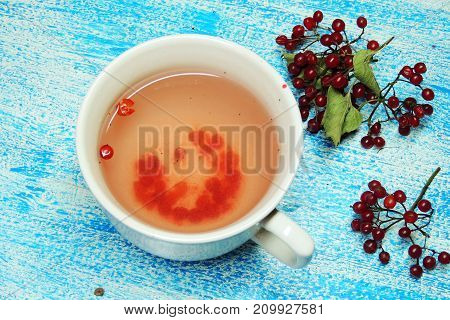Hot tea viburnum. Tea viburnum in a glass cup.