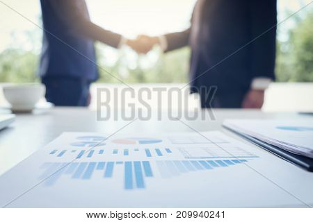 Young executive colleagues discussing and analysis working with new startup project Financial investment on tablet Analyze business and market growth on financial document data graph handshake.
