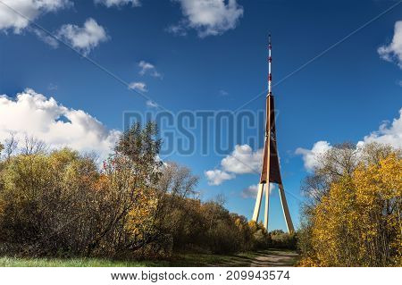 TV tower during autumn time, high telecommunication tower in Riga, Latvia