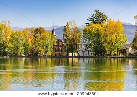 Autumn Colors And Reflection On The Puigcerda's Pond Water