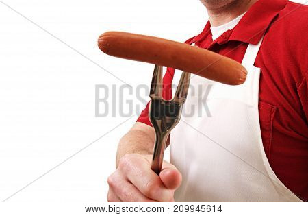 a cook out chef serving a hotdog.