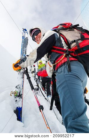 Cross country skiier ascending a slope. Extreme dedication and motivation.