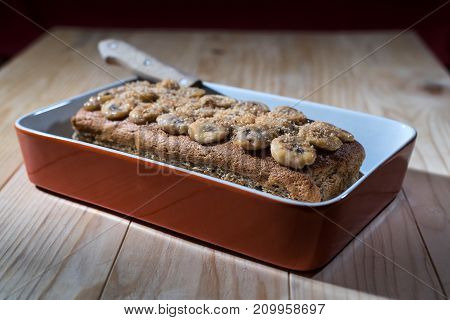 Banana bread in the baking pan ready to be sliced and served