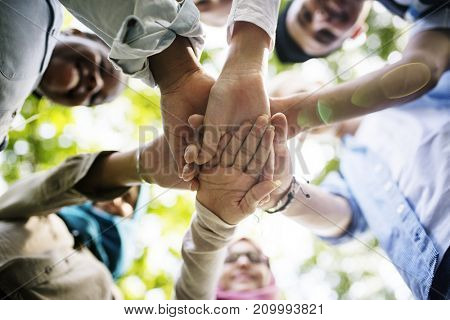 Group of diverse youth hands joined