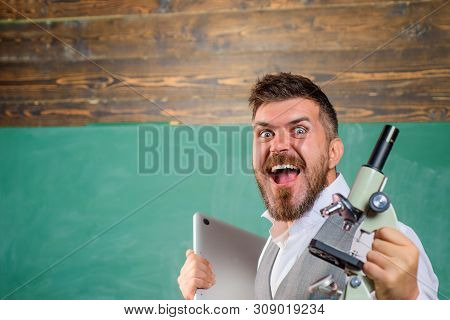 Happy Student With Laptop And Microscope. Bearded Man With Notebook And Microscope. Biology Or Chemi
