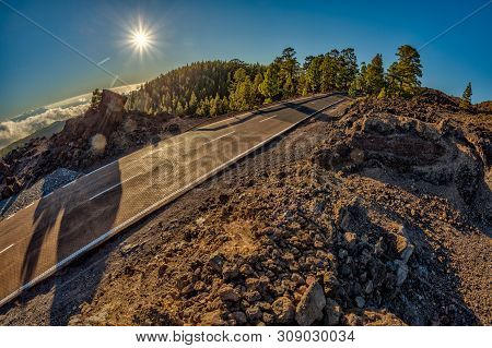 Fish Eye Lens Shot Of Sunset Time Above The Clouds In The Mountains. Fresh Lava Fields. Park Road Cr