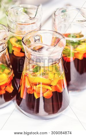 Several Pither Jugs With Traditional British Summer Pimms Cocktail Punch With Lemonade, Strawberries