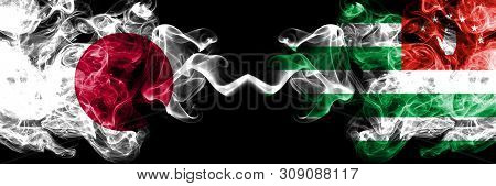 Japan Vs Abkhazia, Abkhazian Smoky Mystic Flags Placed Side By Side. Thick Colored Silky Smokes Comb