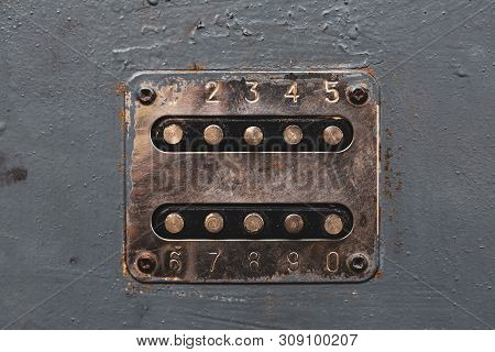 Copper Color Number Buttons To Unlock The Door Lock. Cupreous Panel With Numbers On The Old Metal Do