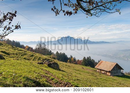 Mount Pilatus And Lake Lucerne Covered With Frog, Alps, Switzerland