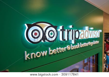 HONG KONG, CHINA - CIRCA APRIL, 2019: close up shot of TripAdvisor sign in a store at Hong Kong International Airport.