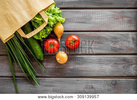 Healthy Food With Fresh Vegetables In Paper Bag On Wooden Background Top View Space For Text