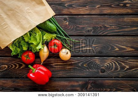 Buying Fresh Vegetables In Paper Bag On Wooden Background Top View Copyspace