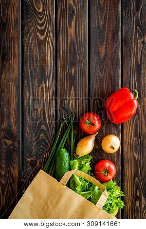 Healthy Food With Fresh Vegetables In Paper Bag On Wooden Background Top View Space For Text