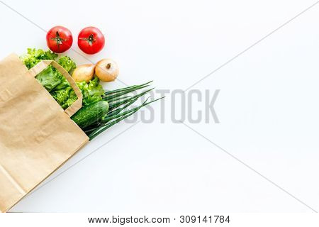 Healthy Food With Fresh Vegetables In Paper Bag On White Background Top View Space For Text