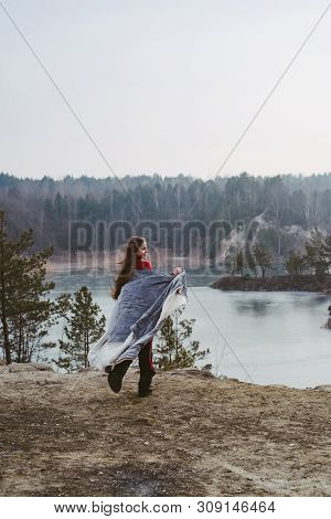 Young Beautiful Girl Posing On A Background Of Lake