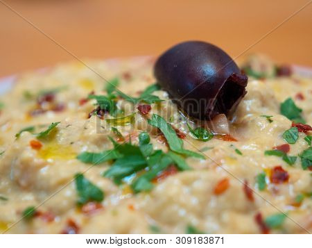 Babaganoush - Meze Or Turkish Appetizer Close Up - Eggplant Paste - Garnished With Olive, Pepper Fla