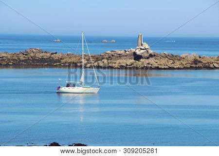 Coast And Sailboat In Landunvez At Low Tide