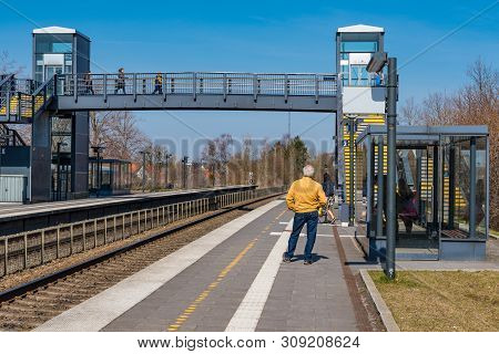 Glumso Denmark - April 8. 2019: People Waiting For The Train At Glumso Train Station