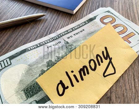 Payments Alimony. Pile Dollars With Sign Alimony And Money. Divorce And Separation Concept.