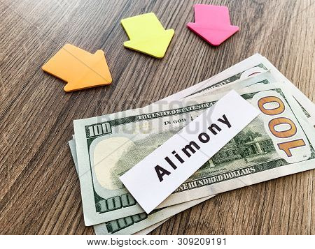 Payments Alimony. Pile Dollars With Sign Alimony And Money. Divorce And Separation Concept.