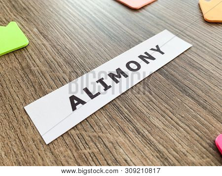 Divorce And Separation Concept. Alimony Written On White Card.