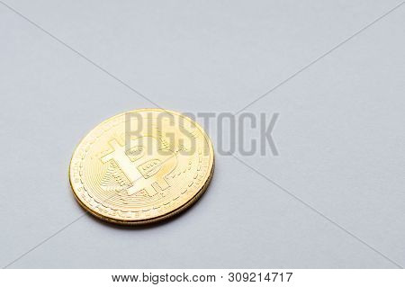 Golden Bitcoin On White Background. Concept Mining. Copyspace