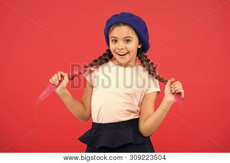 Kid Little Cute Girl Smiling Face Posing In Hat Red Background. How To Wear French Beret. Beret Styl