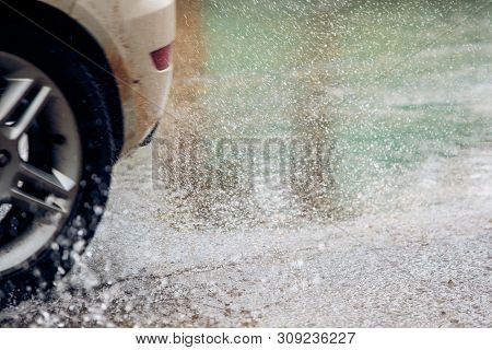 Abstract Blur Cars Run Through Waterways On The Roads, Cars With Floods, Running Wheels On The Water